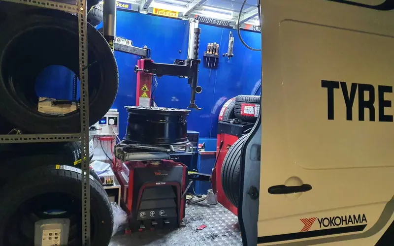 Inside a mobile tyre fitting van: tyre changer, balancer and new tyres