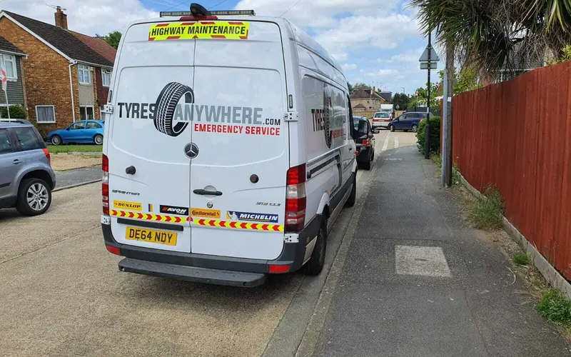 The back of a Tyres Anywhere van parked on a residential street