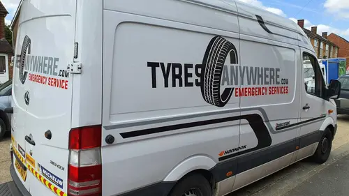 A Tyres Anywhere van parked at a call-out on a residential street