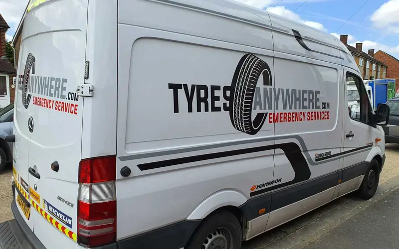 A Tyres Anywhere van parked at a call-out on a residential street