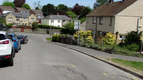 Potholes in a residential street, a common cause of sidewall bulges