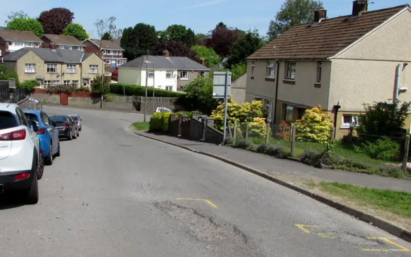 Potholes in a residential street, a common cause of sidewall bulges