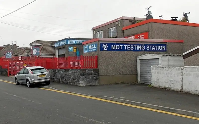 A garage with an MOT testing station sign