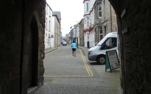 High Street in Caernarfon through the town wall arch